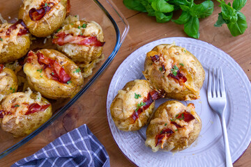 Baked potatoes with bacon and mozzarella