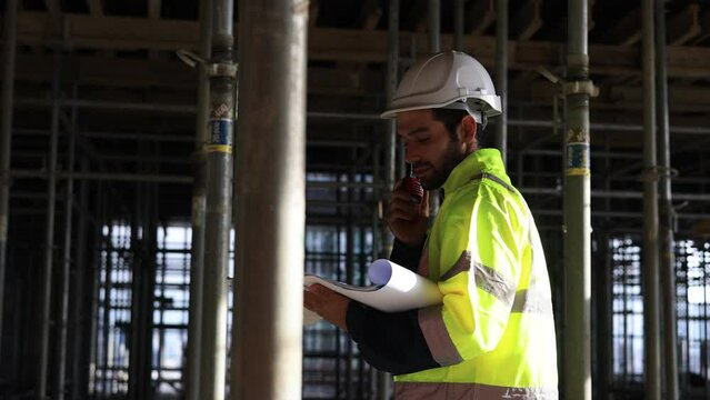 architect engineer using walkie-talkie command and control mega construction project