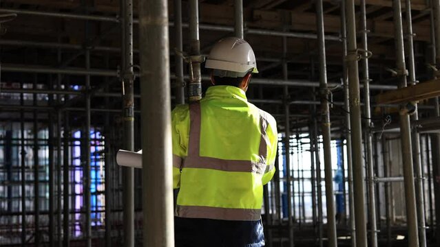 architect engineer using walkie-talkie command and control mega construction project