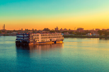 Fototapeta premium Cruise ships awaiting locking. Sunset on the Nile.