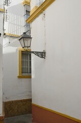 Narrow alley in Seville - 679312242