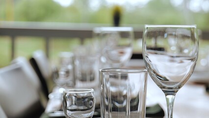Glassware on the festive table. Glasses and wine glasses on the table.