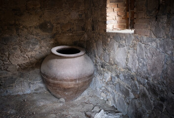 ancient roman olive oil or wine ceramic jar container in an abandoned room. Cyprus traditional culture