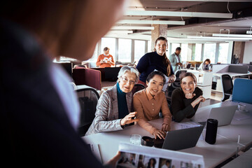 Diverse Group Engaging in a Collaborative Office Project