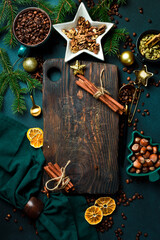 Christmas concept. Kitchen cutting board with festive cutlery on table. Free copy space. Top view...