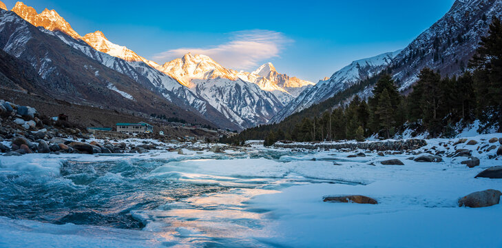 Serene Landscape of frozen Baspa river valley near Chitkul village in Kinnaur district of Himachal Pradesh, India. It is the last inhabited village near the Indo-China border.