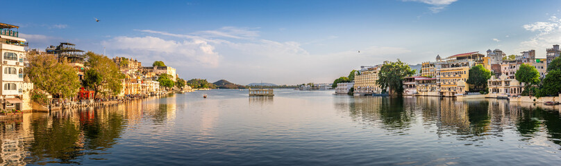 Fototapeta na wymiar Panoramic view of city of lakes, Udaipur with lake Pichola from Ambrai ghat, Rajasthan, India.