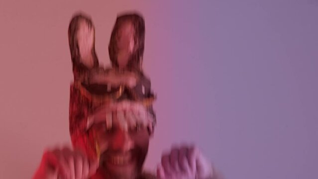 comic handsome Bunny man, Happy attractive young guy in cringe bunny mask hopping, looking at camera, Happy holiday and funny day concept, Humor and Creative Celebration