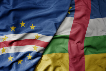 big waving national colorful flag of cape verde and national flag of central african republic .