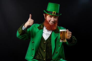 Leprechaun elf on St. Patrick's Day. Cheerful character Irish leprechaun for advertising with a red...