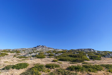 Fototapeta na wymiar Beautiful rocky landscape of high plateau of Torre with little vegetation on a sunny autumn day, Torre, Serra da Estrela, Portugal