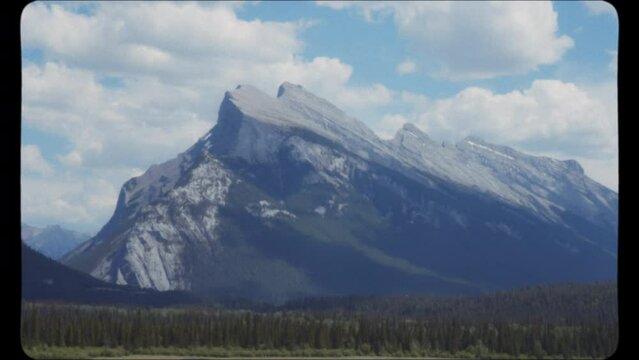 Beautiful Rundle Mountain peak in Banff National Park in Canada. Vintage Film Look.