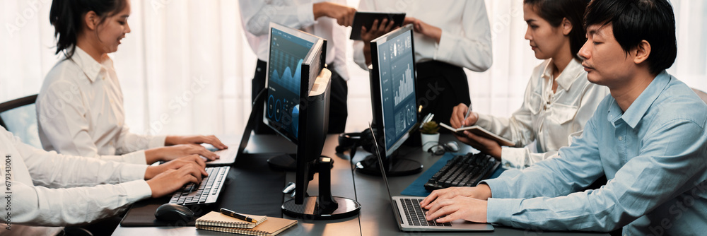 Poster analyst working on data analysis or bi dashboard on computer monitor. business team analyzing financ