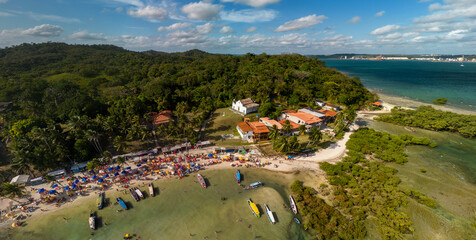 Imagem aérea da praia das Neves e da igreja de Nossa Senhora das Neves em Ilha de Maré, localizada no município de Salvador, no estado da Bahia, Brasil - obrazy, fototapety, plakaty