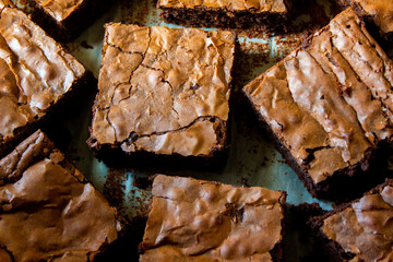 Detail of some delicious dark chocolate brownies straight out of the oven.