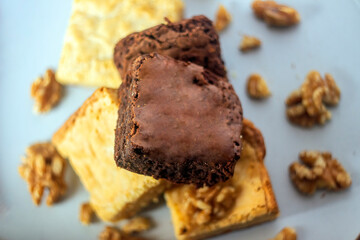 Stack of white and dark chocolate brownies.