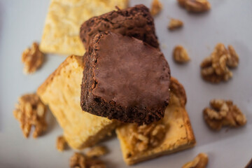 Stack of white and dark chocolate brownies.