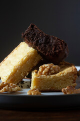 Stack of white and dark chocolate brownies.