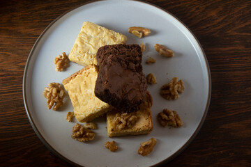 Stack of white and dark chocolate brownies.