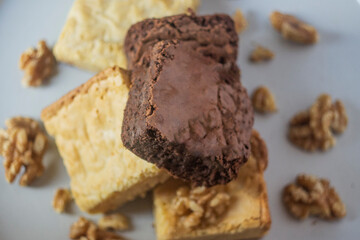 Stack of white and dark chocolate brownies.