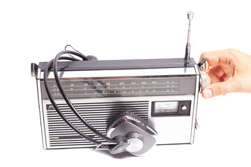 Retro ghetto radio boom box cassette recorder from 80s with hand tuning radio receiver button and headphones