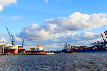 Port of Hamburg with loading cranes on the river Elbe in Hamburg, Germany