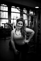 Fototapeta na wymiar beautiful and happy overweight girl in the gym