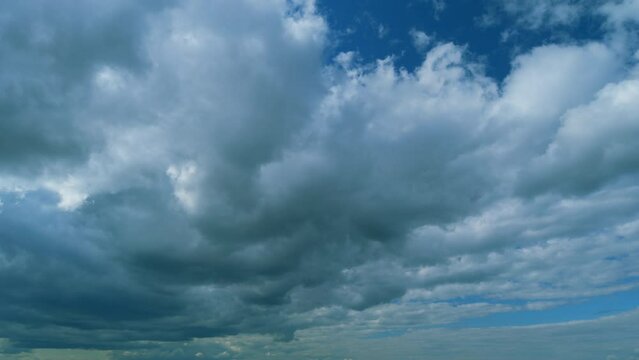 Blue Sky With Beautiful On Different Layers Clouds. Beautiful Sunny Blue Sky Background With Clouds. Timelapse.
