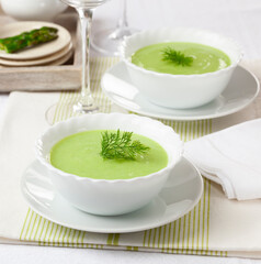 Green asparagus cream decorated with wild dill