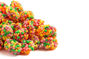 Sweet and Tangy Candy with Small Candies on the Outside of a Chewy Center Isolated on a White...