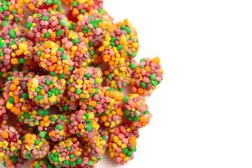 Sweet and Tangy Candy with Small Candies on the Outside of a Chewy Center Isolated on a White...