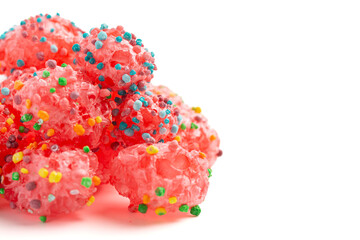 Freeze Dried Sweet and Tangy Candy with Small Candies on the Outside of a Chewy Center  Isolated on a White Background