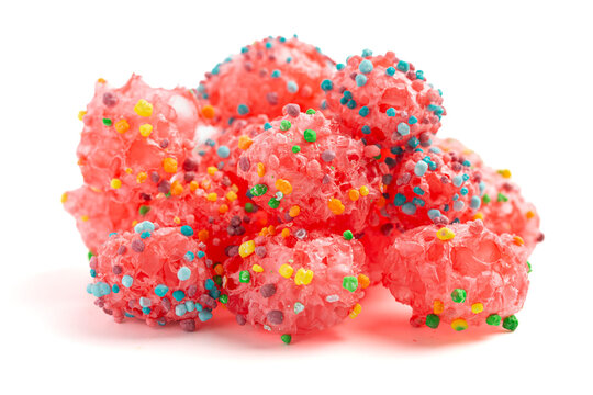 Freeze Dried Sweet and Tangy Candy with Small Candies on the Outside of a Chewy Center  Isolated on a White Background