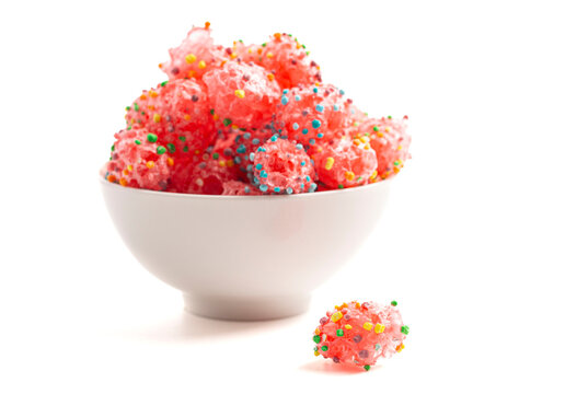 Freeze Dried Sweet and Tangy Candy with Small Candies on the Outside of a Chewy Center  Isolated on a White Background