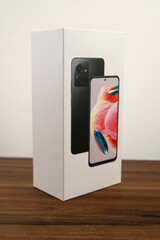 Photo of cell phone case on a wooden table and white background.