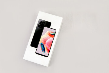 mobile phone in a box , Photo of cell phone box on white background