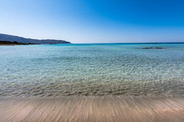 Beautiful view of Elafonisi Beach, Chania. The amazing pink beach of Crete. Elafonisi island is like paradise on earth with wonderful beach with pink coral and turquoise waters.