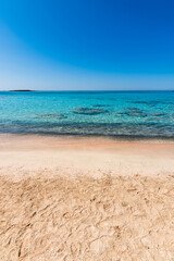 Beautiful view of Elafonisi Beach, Chania. The amazing pink beach of Crete. Elafonisi island is like paradise on earth with wonderful beach with pink coral and turquoise waters.