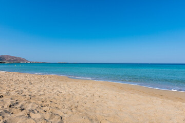 Fototapeta na wymiar View of the sea in the Island with sandy beach, cloudless and clear water. Tropical colours, peace and tranquillity. Turquoise sea. Falasarna beach, Crete island, Greece.