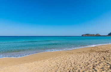 View of the sea in the Island with sandy beach, cloudless and clear water. Tropical colours, peace and tranquillity. Turquoise sea. Falasarna beach, Crete island, Greece.