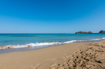 View of the sea in the Island with sandy beach, cloudless and clear water. Tropical colours, peace and tranquillity. Turquoise sea. Falasarna beach, Crete island, Greece.