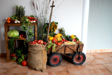 Fruits and vegetables in a wooden cart