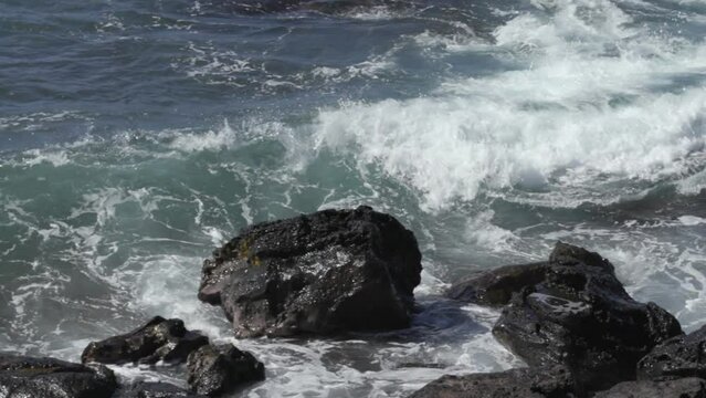 slow motion waves crashing into lava rocks maui hawaii