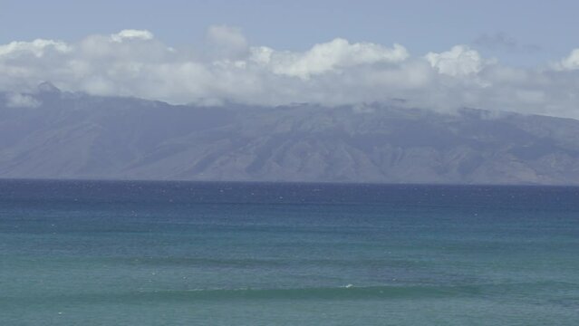 Slow motion waves with Molokai in background from Maui