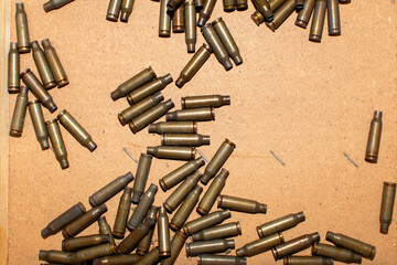 Top view of a ammunition cartridge case of a machine gun  - obrazy, fototapety, plakaty