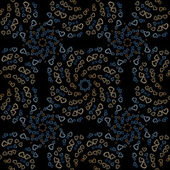 Seamless pattern of yellow and blue hearts flowers on a black background. Print with hearts in kaleidoscopic ornamental style.