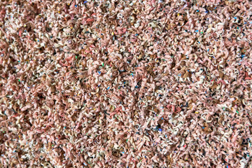 Abstract greyscale texture of intertwined pencil shavings and dust. Highly detailed macro shot. Fine chaotic pattern and visual texture. Background filler. High resolution image.