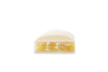 Bar of porous white chocolate on a white isolated background