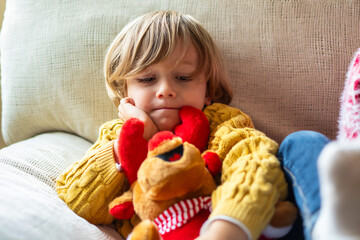 Heartwarming Image of a 4-Year-Old with a Plush Toy