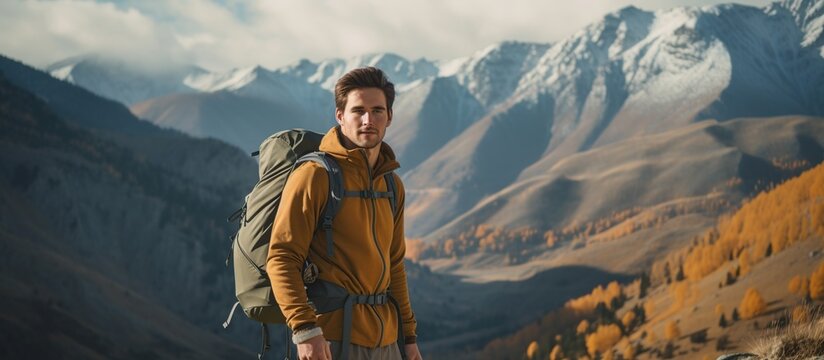 Portrait young man wearing a backpack in mountain at sunny day. AI generated image